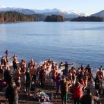 Juneau residents splash into the ocean on New Years Day. (Jasz Garrett / Juneau Empire)