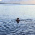 Chris Schleck enjoys the water at Auke Recreation Area on New Years Day. (Jasz Garrett / Juneau Empire)