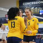 2022 Juneau-Douglas High School: Yadaa.at Kalé graduate Brooke Sanford (5) reacts with teammates during a Regis University Rangers home volleyball match this season in Denver, Colorado. (Regis photo courtesy Makayla Salter)
