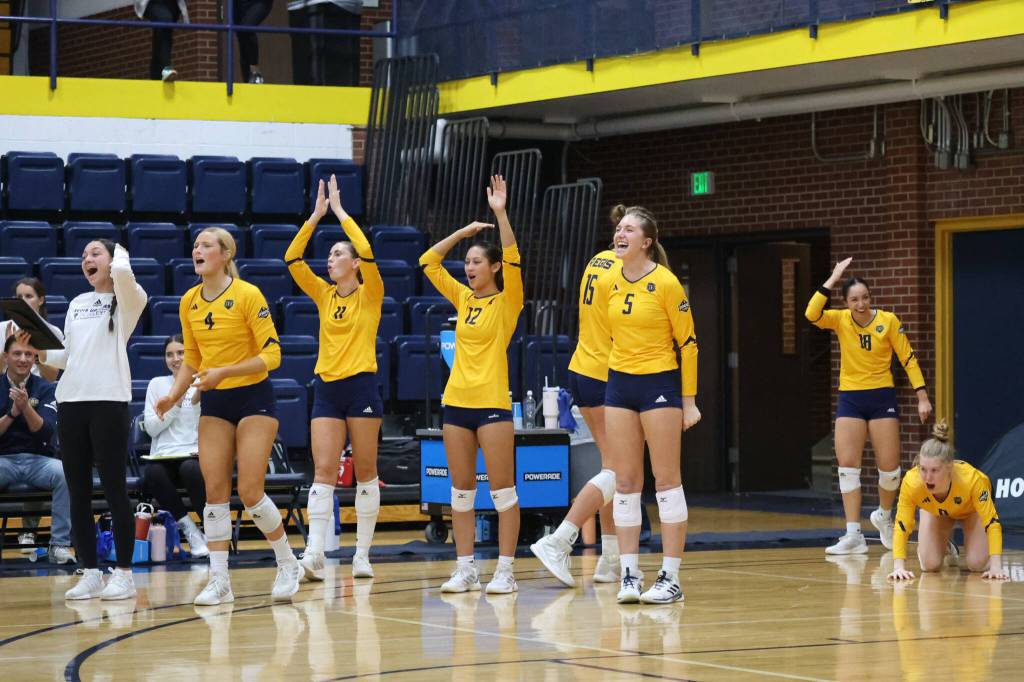 2022 Juneau-Douglas High School: Yadaa.at Kalé graduate Brooke Sanford (5) reacts with teammates during a Regis University Rangers home volleyball match this season in Denver, Colorado. (Regis photo courtesy Makayla Salter)