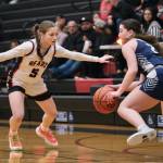 Juneau-Douglas High School: Yadaa.at Kalé sophomore June Troxel (5) presses Soldotna senior Anaulie Sedivy (2) during the Crimson Bears 65-28 win over the Stars on Friday at the George Houston Gymnasium. (Klas Stolpe / Juneau Empire)