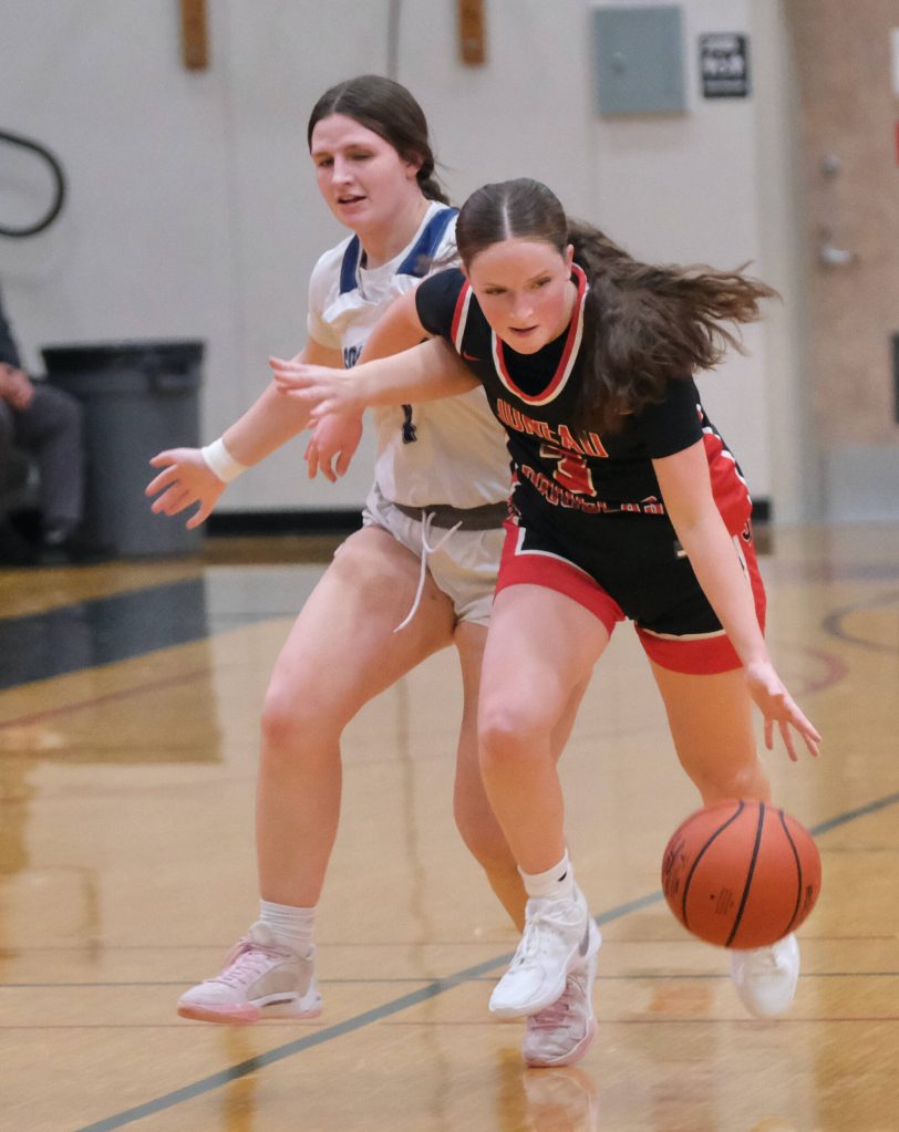 Juneau-Douglas High School: Yadaa.at Kalé junior Cambry Lockhart (3) is fouled by Soldotna senior Anika Jedlicka (4) during the Crimson Bears 63-26 win over the Stars on Saturday at the George Houston Gymnasium. (Klas Stolpe / Juneau Empire)