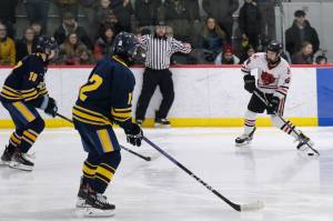 Juneau-Douglas High School: Yadaa.at Kalé junior Elliot Welch (36) takes a shot against Bartlett senior Dylan Beals (19) and junior Phillip Deguzman (12) in a Crimson Bears win earlier this season at Juneaus Treadwell Ice Arena. Welch scored three goals Friday and two Saturday at Homer. (Klas Stolpe / Juneau Empire file photo)