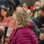 Kristin Garot asks a question to members of Juneaus legislative delegation at a town hall in the Dzantiki Heeni school commons on Monday, Jan. 13, 2025. (Jasz Garrett / Juneau Empire)