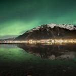 In an undated image provided by Chris Miller, an image of the northern lights in Juneau shows what a camera with a longer exposure captures. As astrotourism booms, the northern lights get a boost from digital photography. (Chris Miller via The New York Times)