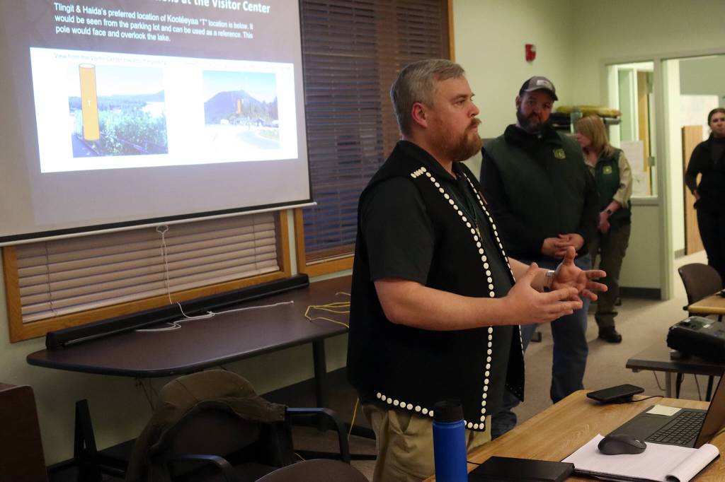 Details about a proposed set of totem poles at the Mendenhall Glacier Visitor Center are explained Wednesday by Jeremy Timothy, cultural ambassador program manager for Central Council of the Tlingit and Haida Indian Tribes of Alaska, during an open house Wednesday at the U.S. Forest Services Juneau Ranger District office. (Mark Sabbatini / Juneau Empire)