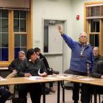 Lee Miller Sr., one of 10 local tribal residents who was a cultural ambassador at the Mendenhall Glacier Visitor Center last year, speaks in favor of a proposed collection of up to five new totem poles at the center during a meeting Wednesday at the U.S. Forest Services Juneau Ranger District office. (Mark Sabbatini / Juneau Empire)