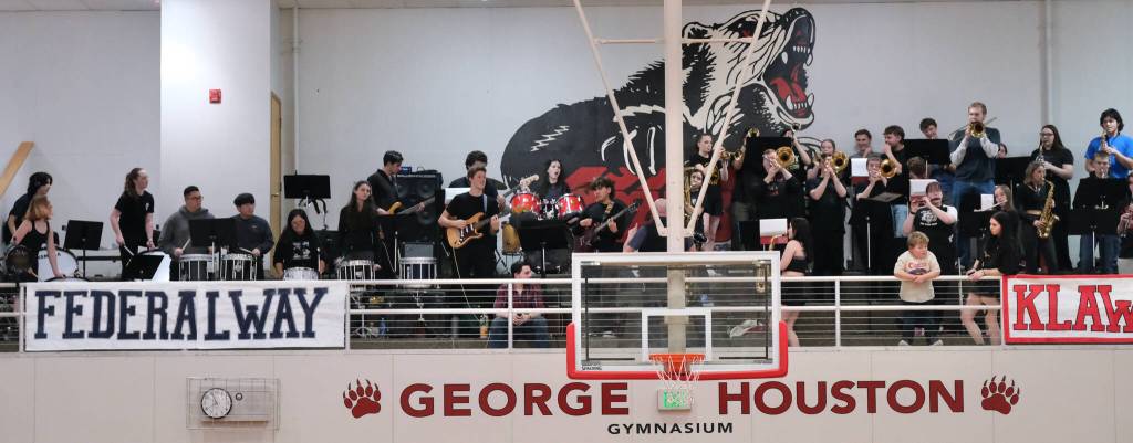 Members of the Juneau-Douglas High School: Yadaa.at Kalé Crimson Bears pep band perform during a home game at the George Houston Gymnasium earlier this season. (Klas Stolpe / Juneau Empire)