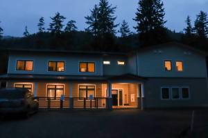 Haven House, Tlingit and Haidas third shelter under their Reentry and Recovery Program, is seen with lights on in the dark. (Jasz Garrett / Juneau Empire)