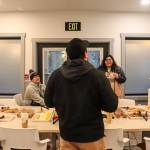 Staff from Tlingit and Haida enjoy refreshments in Haven Houses dining room on Tuesday during an open house. (Jasz Garrett / Juneau Empire)