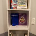 Books on addiction and recovery are seen in Haven Houses meeting room. (Jasz Garrett / Juneau Empire)