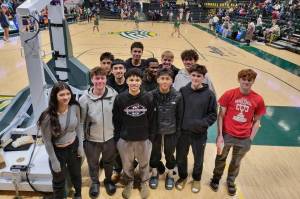 The Juneau-Douglas High School: Yadaa.at Kalé Crimson Bears boys basketball team pose at Anchorages Alaska Airlines Center on Saturday after watching a college game. Earlier in the day JDHS finished their final Colony Basketball Classic tournament game in Palmer, losing to Bettye Davis East Anchorage High School 71-54. (Photo courtesy JDHS)