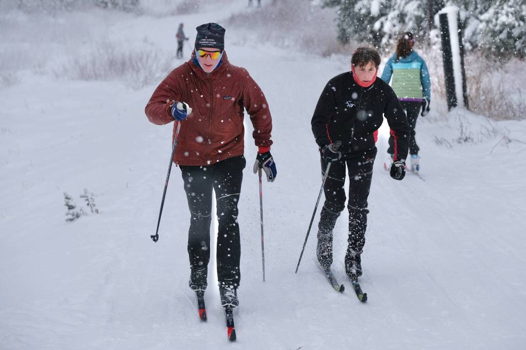 Juneau-Douglas High School: Yadaa.at Kalé Nordic Ski Team seniors Corder Janes and Ferguson Wheeler work classic style uphill repeats during practice Saturday at Eaglecrest. (Klas Stolpe / Juneau Empire)