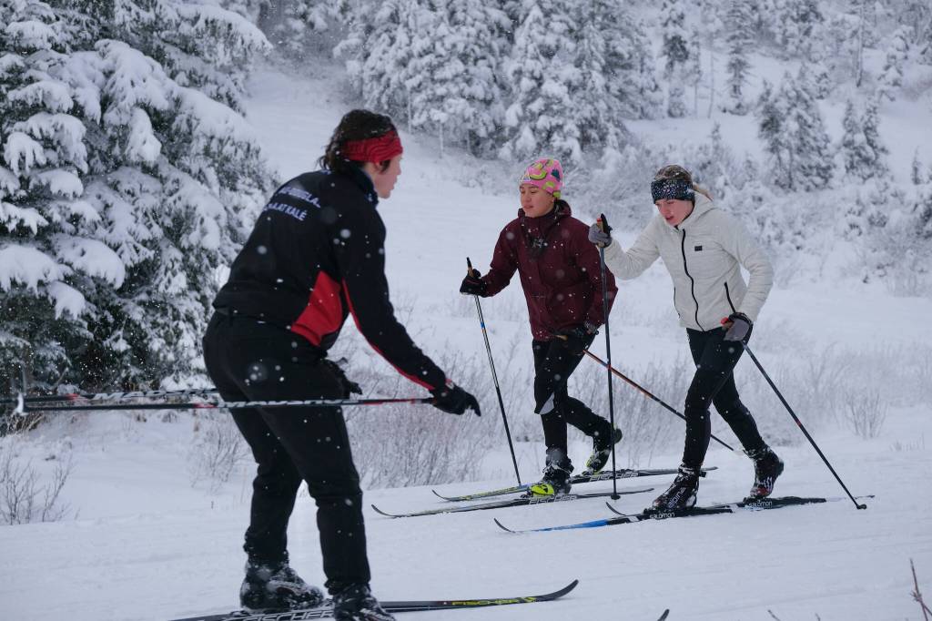 Juneau-Douglas High School: Yadaa.at Kalé Nordic Ski Team senior Finley Hightower gilde downhill as sophomore Kai Mangaccat and junior Siena Farr work classic style uphill repeats during practice Saturday at Eaglecrest. (Klas Stolpe / Juneau Empire)
