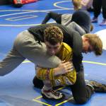 Juneau-Douglas High School: Yadaa.at Kalé sophomore Jed Davis works a technique with junior Marlin Cox on Monday during a three-day wrestling clinic at the Juneau Wrestling Center led by Askren Wrestling Academy coach Wilder Wichman. (Klas Stolpe / Juneau Empire)