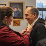 Sen. Donny Olson (D-Golovin) has a flower pinned to his suit following a Senate majority caucus press conference on Tuesday, Jan. 21, 2025. (Jasz Garrett / Juneau Empire)