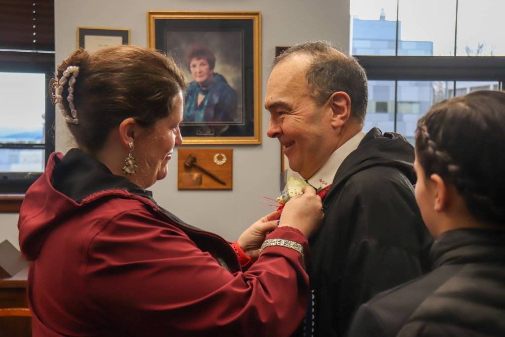 Sen. Donny Olson (D-Golovin) has a flower pinned to his suit following a Senate majority caucus press conference on Tuesday, Jan. 21, 2025. (Jasz Garrett / Juneau Empire)