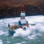 Waves crash over Royal Dutch Shell's conical drilling unit Kulluk, where it sits aground on the southeast side of Sitkalidak Island, Alaska, Jan. 1, 2013. A unified command, consisting of U.S. Coast Guardsmen; federal, state and local partners; and industry representatives, was established in response to the grounding. (U.S. Coast Guard photo by Petty Officer 3rd Class Jonathan Klingenberg)