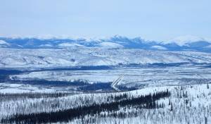 The Dalton Highway winds through the Jim River and Prospect Creek valleys in northern Alaska, where an official thermometer registered Alaskas all-time low of minus 80 degrees F on Jan. 23, 1971. (Photo by Ned Rozell)