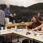 Katie Kachel (left), a federal lobbyist for the City and Borough of Juneau, talks with Juneau Assembly Member Alicia Hughes-Skandijs and Mayor Beth Weldon following a joint meeting of the Assembly and Juneaus legislative delegation on Thursday at the Assembly Chambers. (Mark Sabbatini / Juneau Empire)