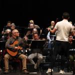 The Juneau Symphony rehearses for its winter mainstage concert in the Juneau-Douglas High School: Yadaa.at Kalé auditorium on Jan. 23, 2025. (Jasz Garrett / Juneau Empire)