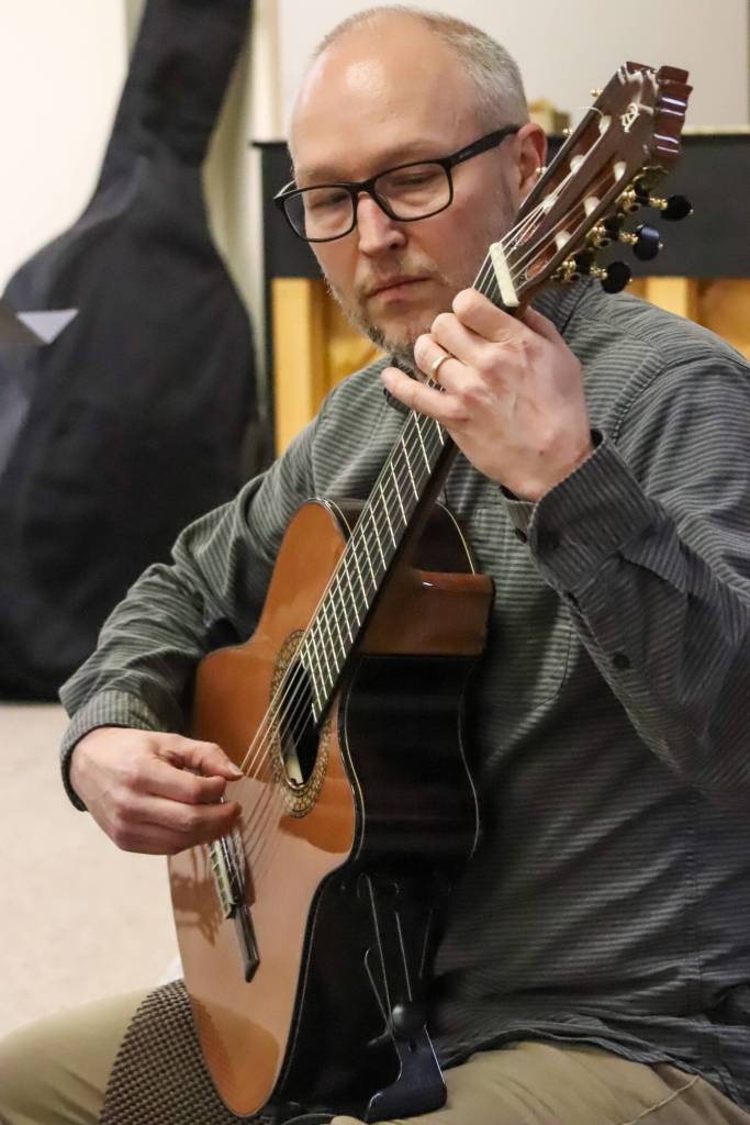 John Unzicker practices in the Juneau-Douglas High School: Yadaa.at Kalé music room on Jan. 23, 2025. (Jasz Garrett / Juneau Empire)