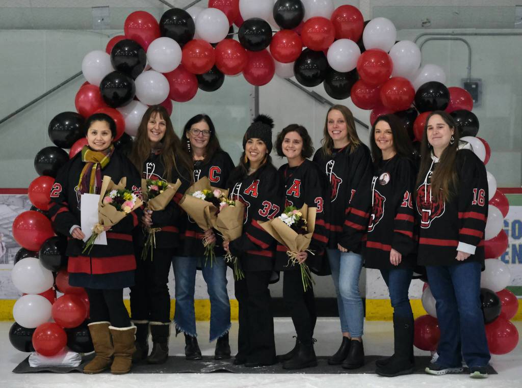 Mothers of Juneau-Douglas High School: Yadaa.at Kalé Crimson Bears seniors pose for a photo before Fridays game against the visiting Kenai Kardinals at Treadwell Ice Arena. (Klas Stolpe / Juneau Empire)