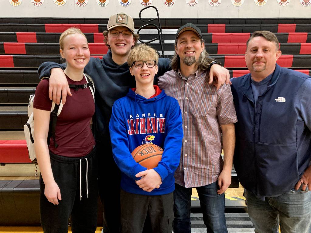 Evan, Maquire, Quince, Chris and Jer Hamey pose for a family photo on Saturday inside the George Houston Gymnasium. (Klas Stolpe / Juneau Empire)