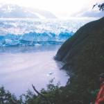 Ned Rozell watches the advance of Hubbard Glacier as it advances on Gilbert Point in 2002. (Photo by Martin Truffer)