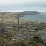 A Shinto shrine remains on Kiska Island after a brief Japanese occupation during World War II. The Alaska Maritime National Wildlife Refuges ship, the Tiglax, floats in the background. (Photo by Ned Rozell)