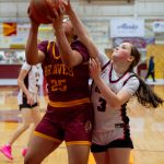 Mount Edgecumbe HIgh Schools Charity Mila (25), a sophomore from Barrow, shoots against strong defense from Juneau-Douglas High School: Yadaa.at Kalé junior Cambry Lockhart (3) Saturday at the B.J. McGillis Gym. (James Poulson / Daily Sitka Sentinel)