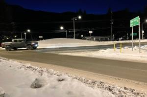 The roundabout at the intersection of Mendenhall Loop Road and Stephen Richards Memorial Drive on Monday morning after it was reopened following a shooting between two men in vehicles shortly after midnight. (Laurie Craig / Juneau Empire)