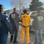A photo posted on social media by the U.S. Drug Enforcement Agencys Seattle office shows a person being arrested as part of immigration enforcement efforts in Anchorage in recent days. (U.S. Drug Enforcement Agency photo)