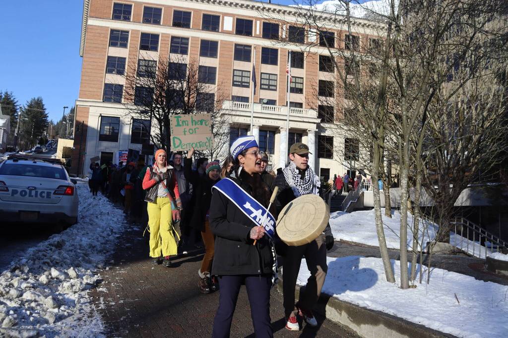 Jamiann Seiltin Hasselquist leads protesters on a march toward the heart of downtown Juneau following a rally at the Alaska State Capitol on Wednesday focused on President Donald Trumps actions since the beginning of his second term. (Mark Sabbatini / Juneau Empire)