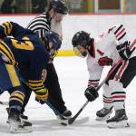 Juneau-Douglas High School: Yadaa.at Kalé senior Dylan Sowa (35) beats Bartlett senior Wyatt Rust (13) in a faceoff earlier this season. Sowa scored four goals in Thursdays 5-4 extra-time win over the Houston Hawks to open the 2025 ASAA Division II Hockey State Tournament at Soldotna. (Klas Stolpe / Juneau Empire file photo)