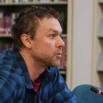 Aaron Surma, executive director of the National Alliance on Mental Illness Juneau and the Juneau Suicide Prevention Council, gives a solo testimony to the Juneau Board of Education on Feb. 6, 2025. (Jasz Garrett / Juneau Empire)