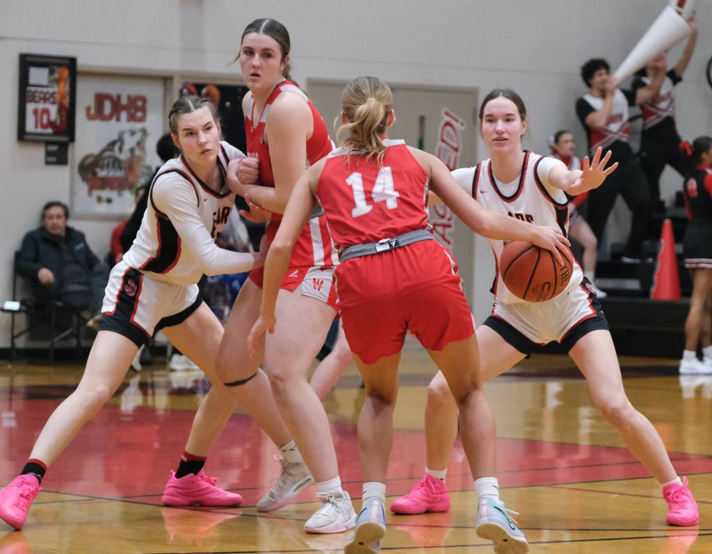 Juneau-Douglas High School: Yadaa.at Kalé seniors Kerra and Cailynn Baxter try to defend Wasilla senior Layla Hays and Mylee Anderson (14) during the Crimson Bears 65-34 loss Friday to the Warriors in the George Houston Gymnasium. (Klas Stolpe / Juneau Empire)
