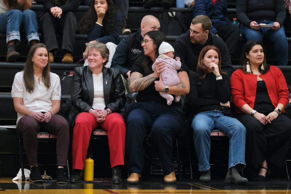 Wasilla coach Jeannie Hebert-Truax (second from left) visits with Juneau-Douglas High School: Yadaa.at Kalé coach Tanya Nizich and Crimson Bears assistants Nicole Fenumiai, Angie Kemp and Jasmine James before Fridays game in the George Houston Gymnasium. (Klas Stolpe / Juneau Empire)