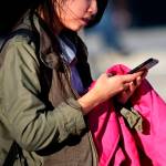 A girl uses her cellphone at Bronx High School of Science in New York on Jan. 11, 2016. (Yana Paskova for The New York Times)