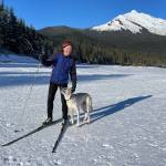 Skate skier Scott Watts and his dog complete a 37-minute run on a groomed trail that leads around a loop course on Mendenhall Lake on Tuesday, Feb. 11, 2025. (Laurie Craig / Juneau Empire)