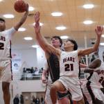 Juneau-Douglas High School: Yadaa.at Kalé junior Joren Gasga (12), junior Tyler Frisby (21) and senior Ahmir Parker (2) battle with Ketchikan senior Marcus Stockhausen for a rebound during their series early in the season at JDHS. (Klas Stolpe / Juneau Empire)