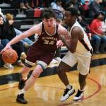 Juneau-Douglas High School: Yadaa.at Kalé senior Ahmir Parker (2) guards Ketchikan senior Marcus Stockhausen (34) during their series early in the season at JDHS. Parker has been a "jack-of-all-trades" for the Crimson Bears this season. (Klas Stolpe / Juneau Empire)