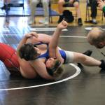 Thunder Mountain Middle School wrestler Koltin Vick attempts a pin against schoolmate Tyson Foster during the inaugural Thunder Mountain Mayhem Team Duels Wrestling Tournament on Feb. 1. (Klas Stolpe / Juneau Empire)