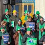 Members of the Alaska State Employees Association and AFSCME Local 52 holds a protest on the steps of the Alaska State Capitol on Friday, Feb. 14, 2025. (Jasz Garrett / Juneau Empire)