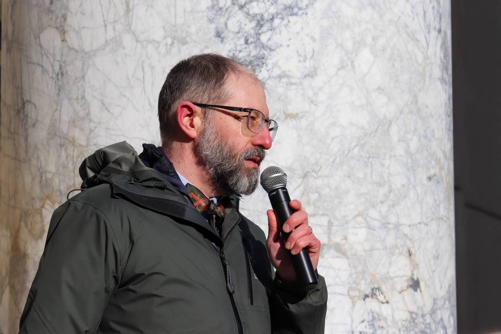 Sen. Jesse Kiehl (D-Juneau) speaks at a rally where state employees ask for higher pay on Friday, Feb. 14, 2025. (Jasz Garrett / Juneau Empire)