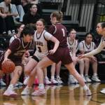 Juneau-Douglas High School: Yadaa.at Kalé sophomore Cambry Lockhart (3) defends Ketchikan senior Lilli Goodwin (21) as Kayhi junior Kali MacManus (1) sets a screen and JDHS senior Addison Wilson helps on defense during the Crimson Bears 51-23 win over the Lady Kings on Friday in Juneau. (Klas Stolpe / Juneau Empire)