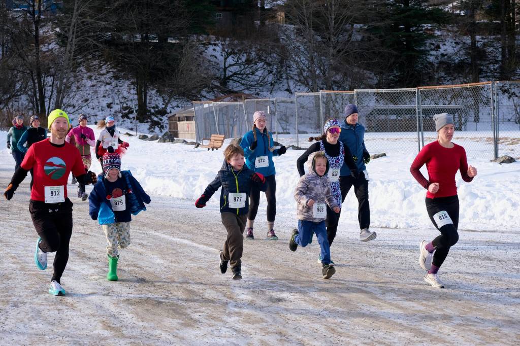 Runners start the Sweetheart Relay on Saturday at Sandy Beach. (Klas Stolpe / Juneau Empire)