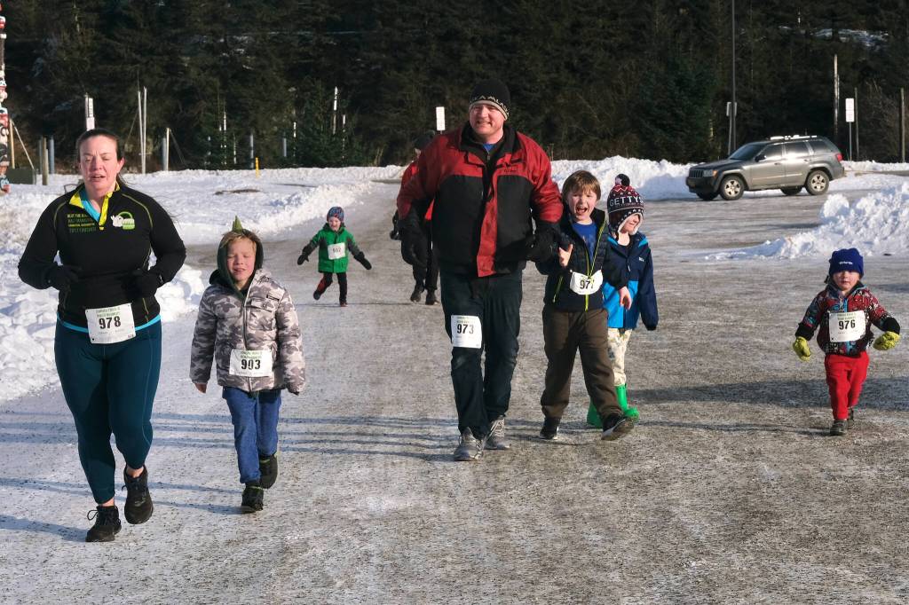 Kaili Nielsen (978), Dylan Nielsen (903), Orion Davis (902), Myron Davis (973), Jet Davis (977), Dominic Davis and Soren Davis (976) finish the Sweetheart Relay on Saturday at Sandy Beach. (Klas Stolpe / Juneau Empire)