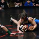 Thunder Mountain Middle Schools Minali Reid works a pin on Schoenbar Knights grappler Loriel Zapanta in the girls 106-pound championship match during the Southeast Middle School Regional Wrestling Tournament on Saturday at TMMS. (Klas Stolpe / Juneau Empire)