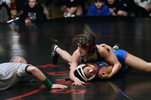 Thunder Mountain Middle Schools Minali Reid works a pin on Schoenbar Knights grappler Loriel Zapanta in the girls 106-pound championship match during the Southeast Middle School Regional Wrestling Tournament on Saturday at TMMS. (Klas Stolpe / Juneau Empire)